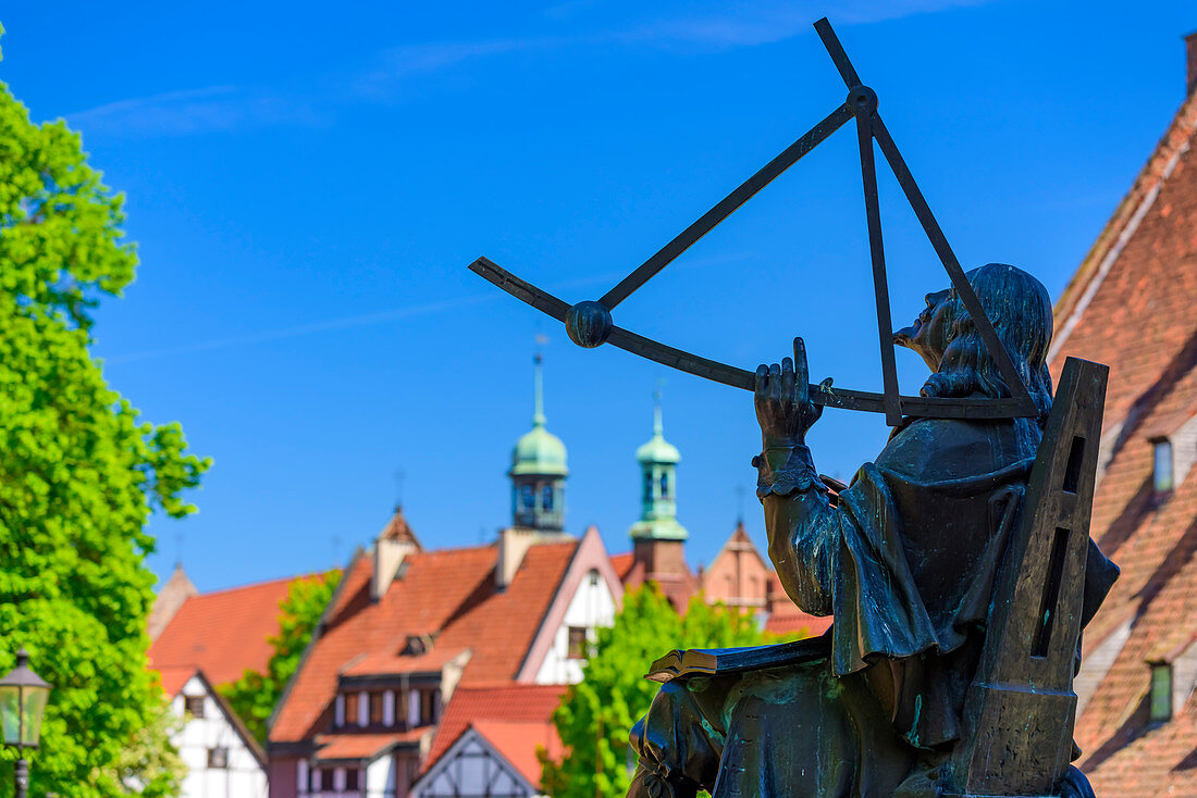 Monument of astronomer Johannes Hevelius, roofs and towers around Hevelius Square. Gdansk, Main City, Pomorze region, Pomorskie voivodeship, Poland, Europe