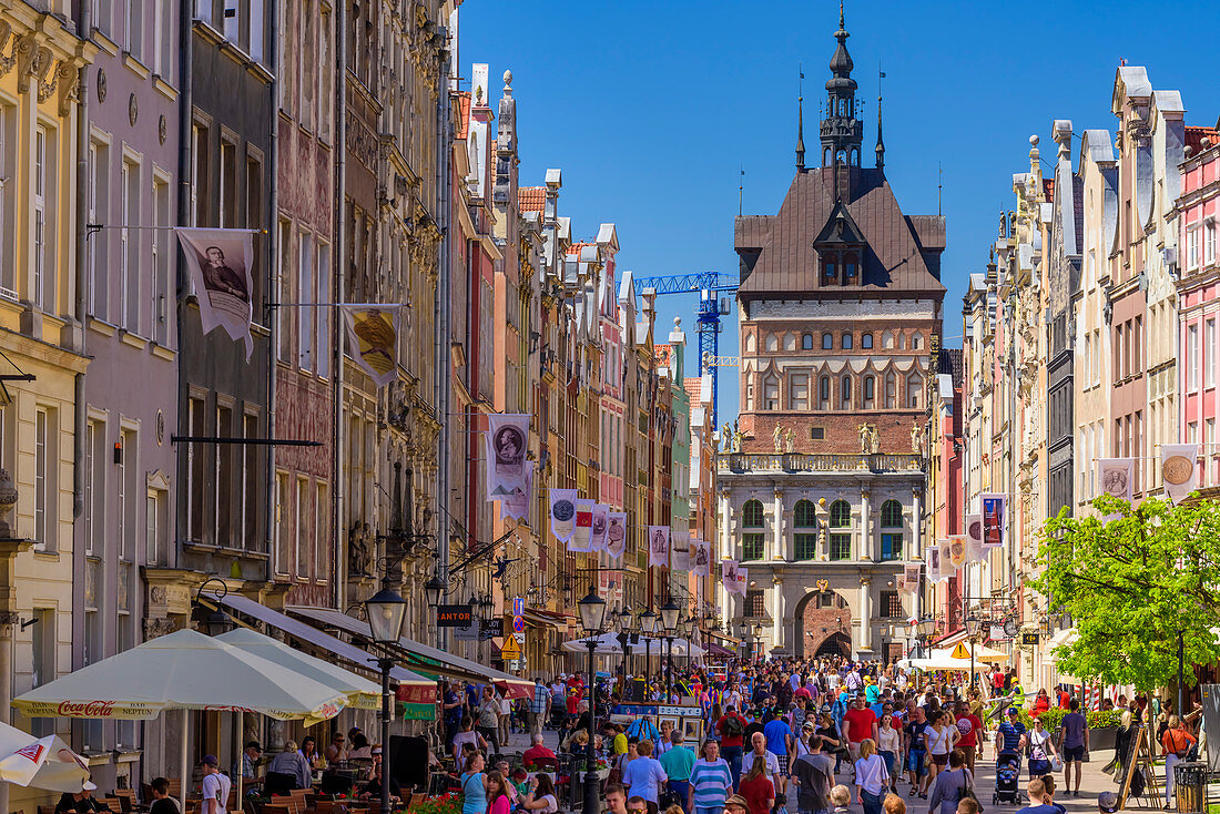 Gdansk, Main City, old town, Dluga (Long) street, Golden Gate, behind roof and tower of former prison and torture chamber. Gdansk, Main City, Pomorze region, Pomorskie voivodeship, Poland, Europe