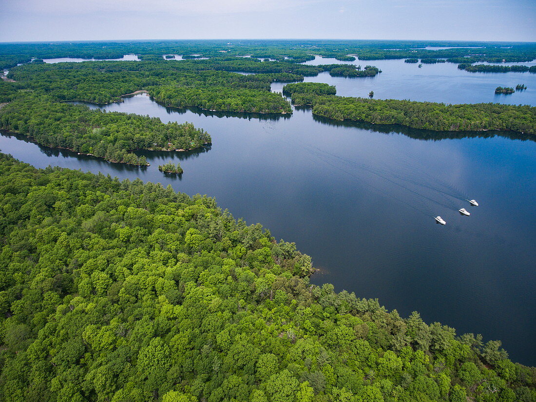 Aerial of islands and three Le Boat Horizon houseboats on Newboro Lake, near Newboro, Ontario, Canada, North America