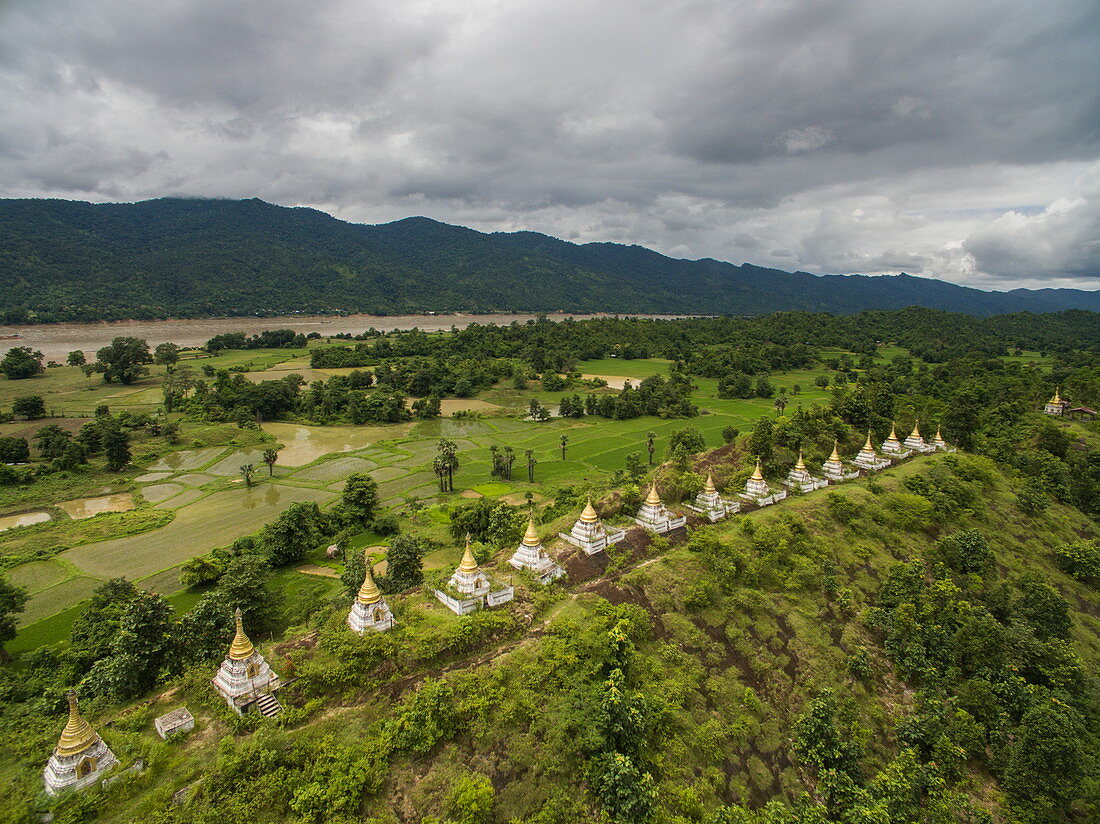 28 Buddhist stupas on hillside at Ma Sein overlooking Chindwin River, near Kalewa, Sagaing Region, Myanmar, Asia