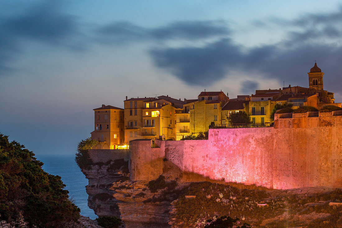 Night view of the Citadel and old town of Bonifacio perched on rugged cliffs, Bonifacio, Corsica, France, Mediterranean, Europe