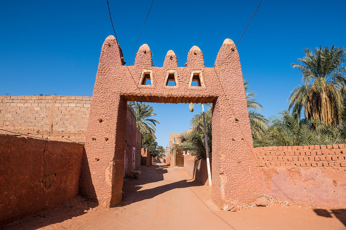 Red town gate in Timimoun, western Algeria, North Africa, Africa