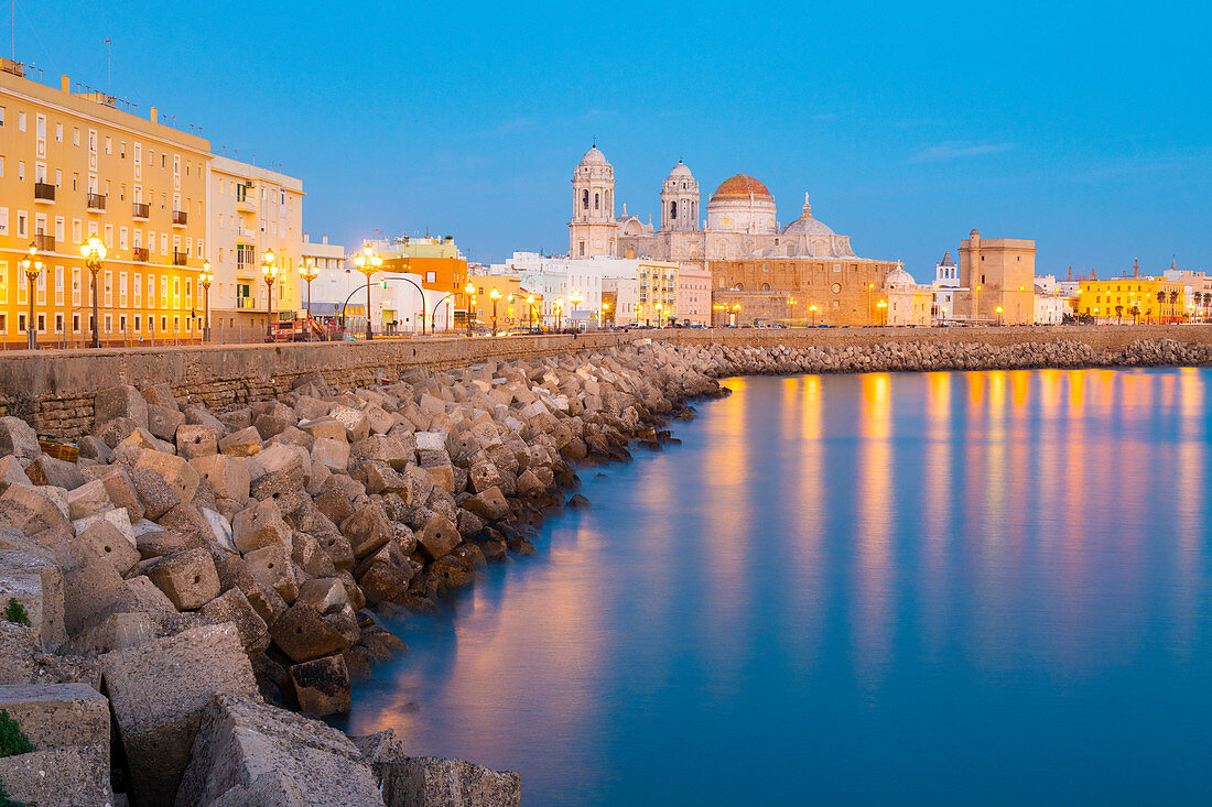 Santa Cruz Cathedral and ocean seen from the promenade along quayside, Cadiz, Andalusia, Spain, Europe