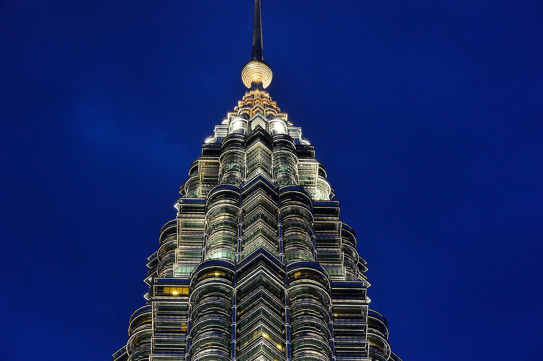 Partial view of the Petronas Towers in Kuala Lumpur, Malaysia, at the blue hour just before nightfall