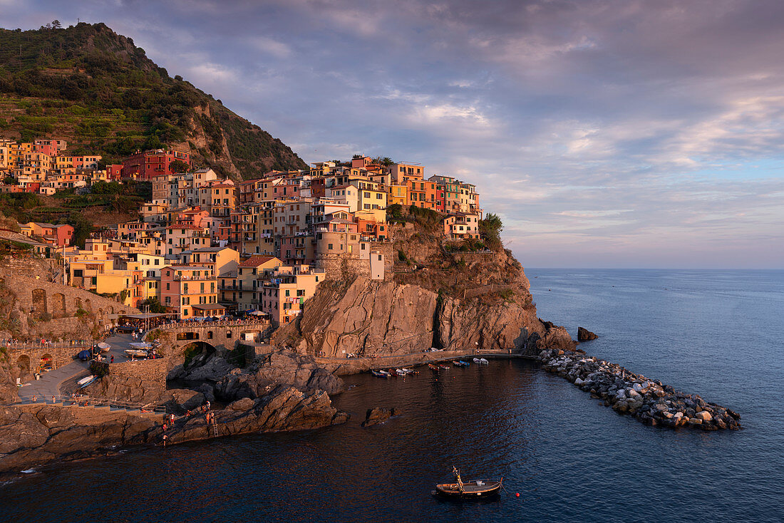 Bay in Cinque Terre with village Manarola in the sunset, Italy