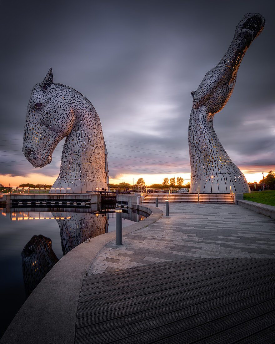 The Kelpies at sunset, Forth and Clyde Canal at Helix Park, Falkirk, Stirlingshire, Scotland, United Kingdom, Europe