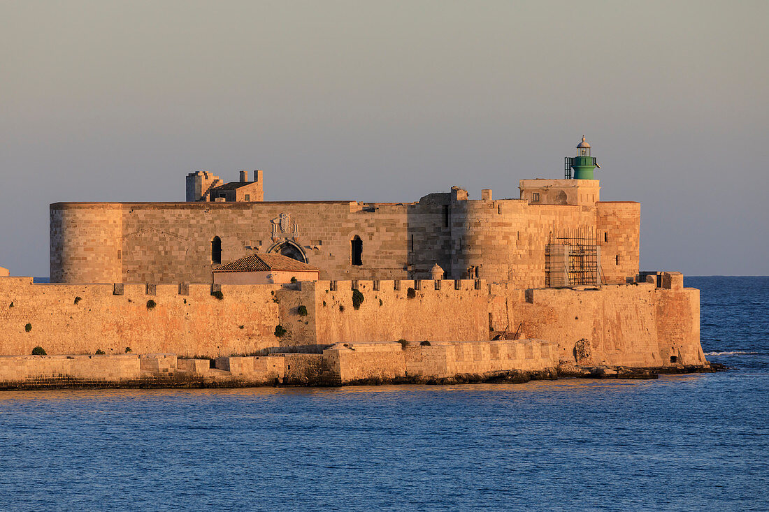 Sunset lights up Maniace Castle, Ortigia (Ortygia), from the sea, Syracuse (Siracusa), UNESCO World Heritage Site, Sicily, Italy, Mediterranean, Europe