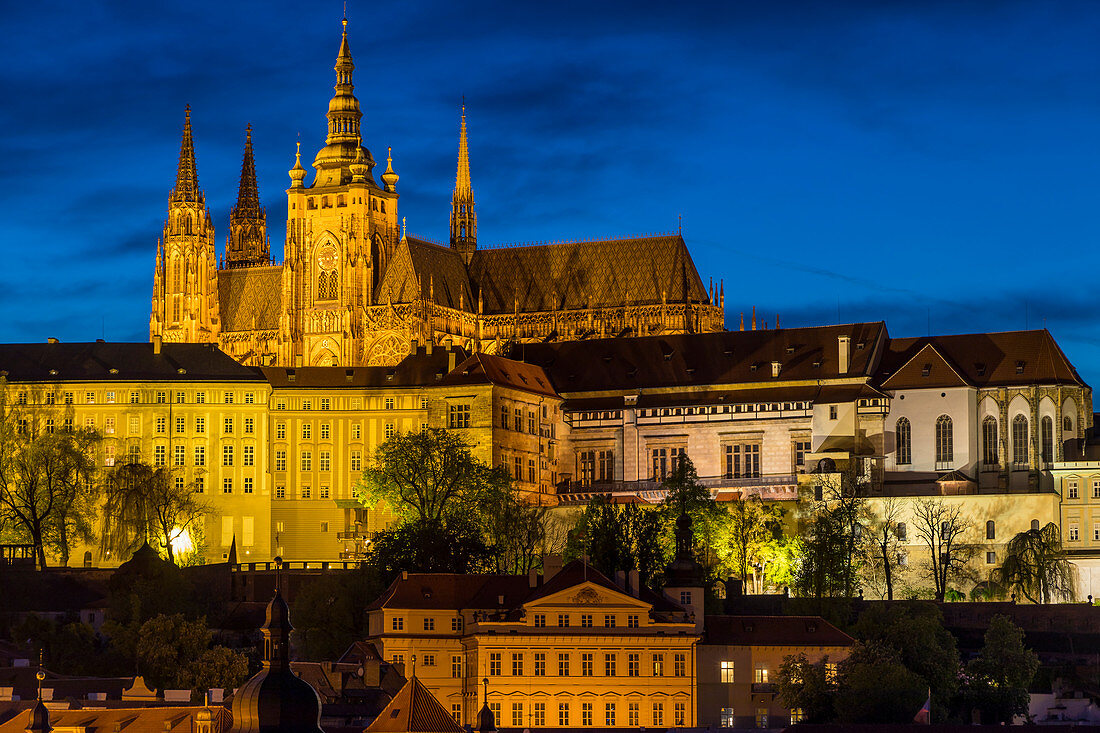 Illuminated Prague Castle and St. Vitus Cathedral seen from the banks of Vltava River, UNESCO World Heritage Site, Prague, Bohemia, Czech Republic, Europe