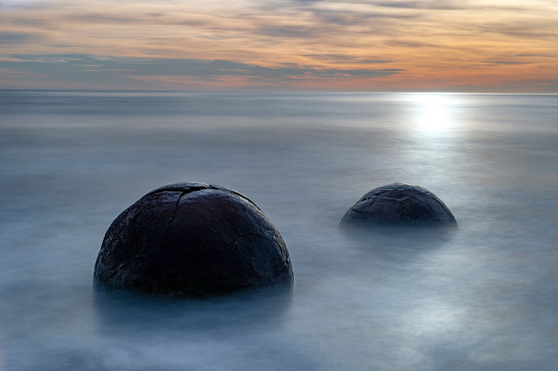 Two Moeraki Boulders at sunrise with long exposure, Moeraki Beach, Otago, South Island, New Zealand, Pacific