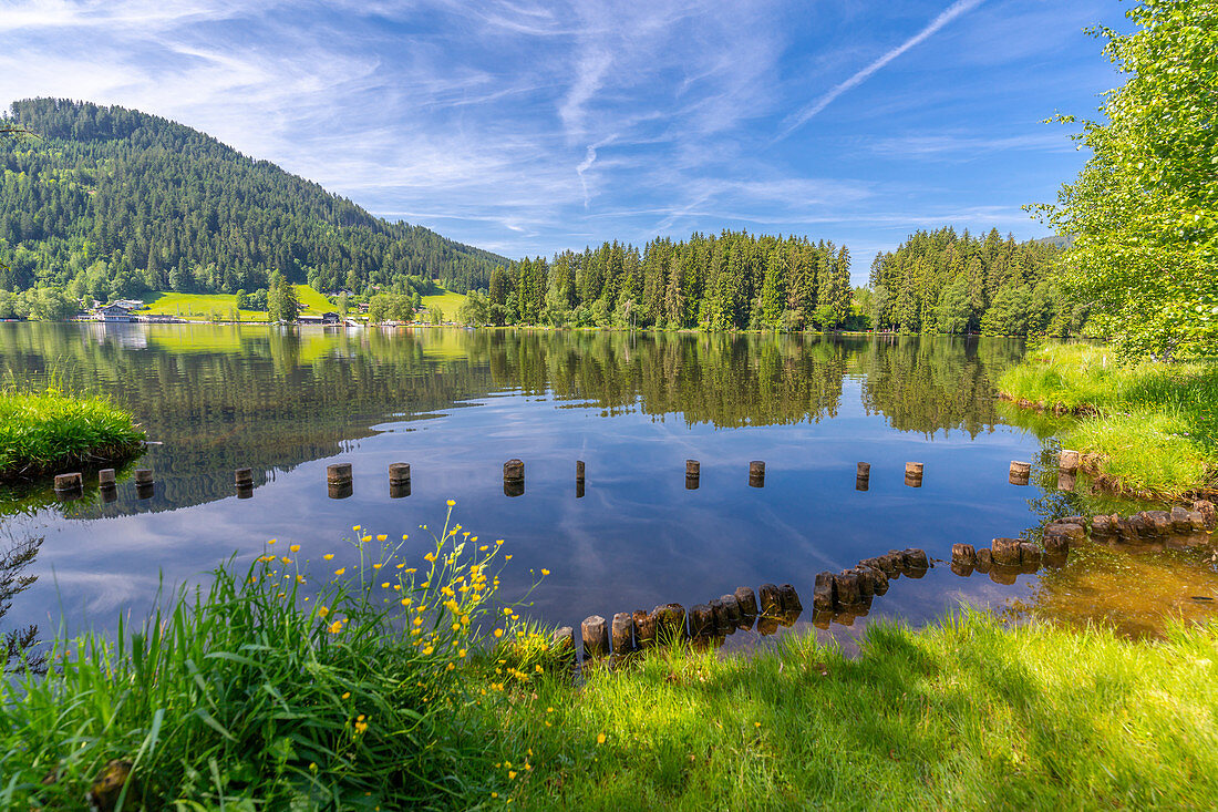 View of reflections in Schwarzsee, Kitzbuhel, Austrian Tyrol, Austria, Europe