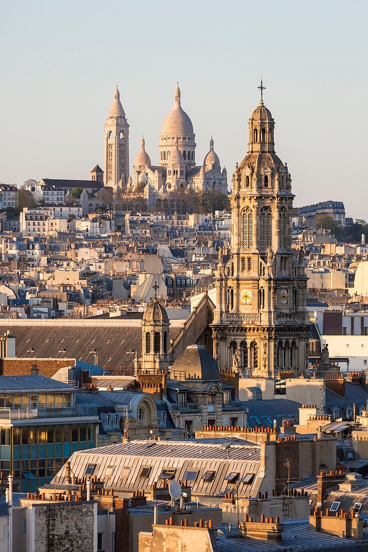 France, Paris, the Basilica of the Sacre Coeur of Montmartre and the bell tower of the church of the Holy Trinity
