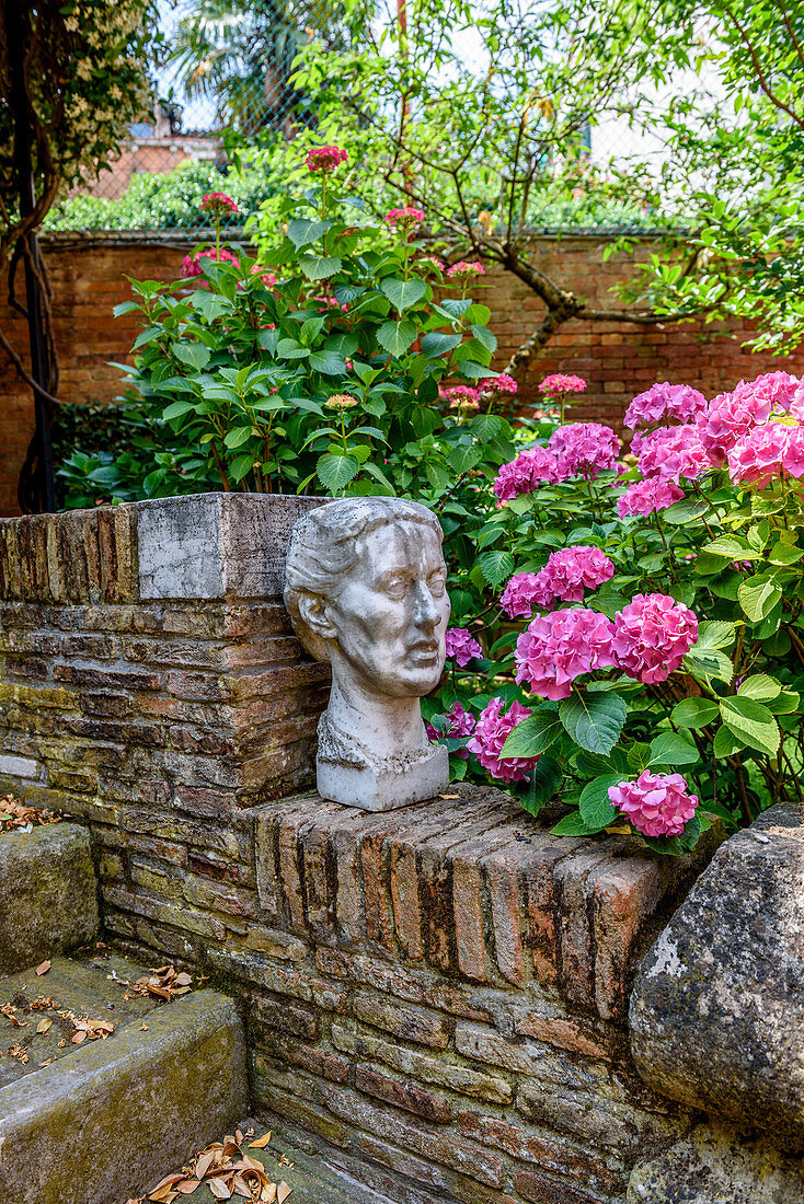 Bust in a garden in Venice, Italy