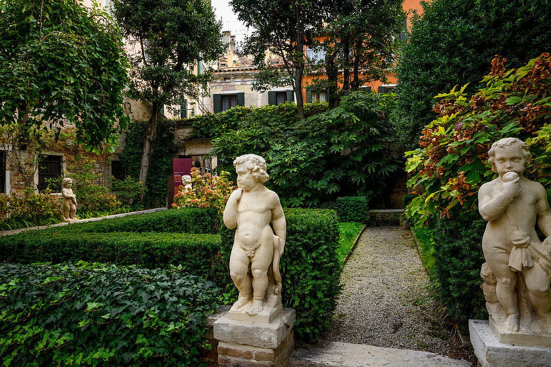 Garden with putti in Venice, Italy