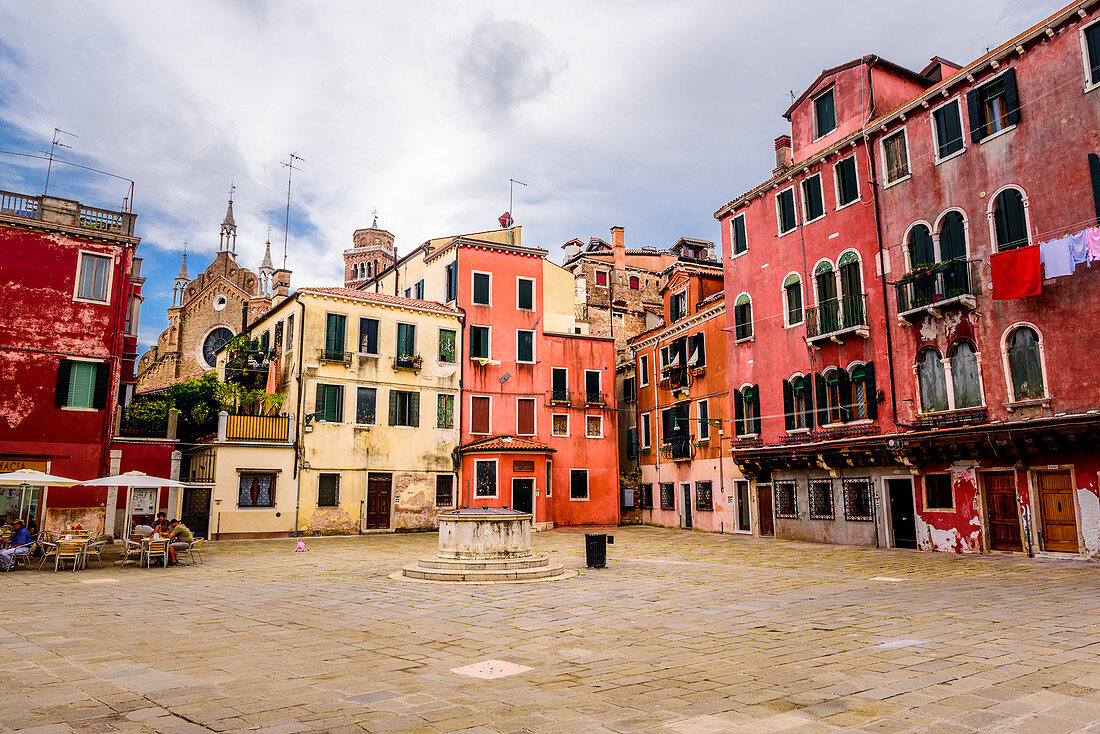 Square with red houses, Venice, Italy