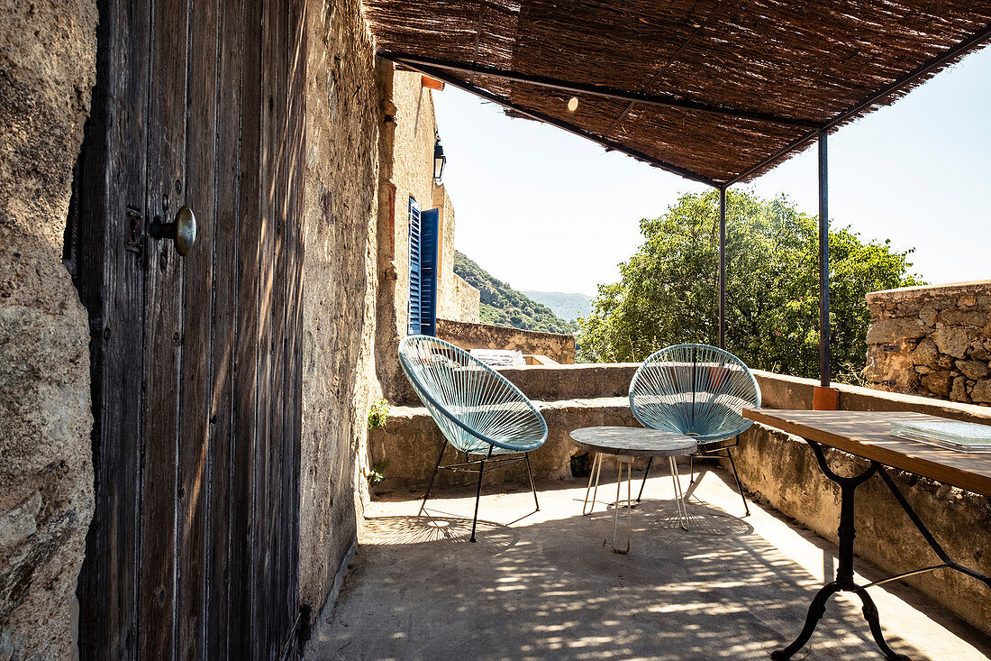 Terrace in the mountain village of Pigna near Calvi, Corsica, France