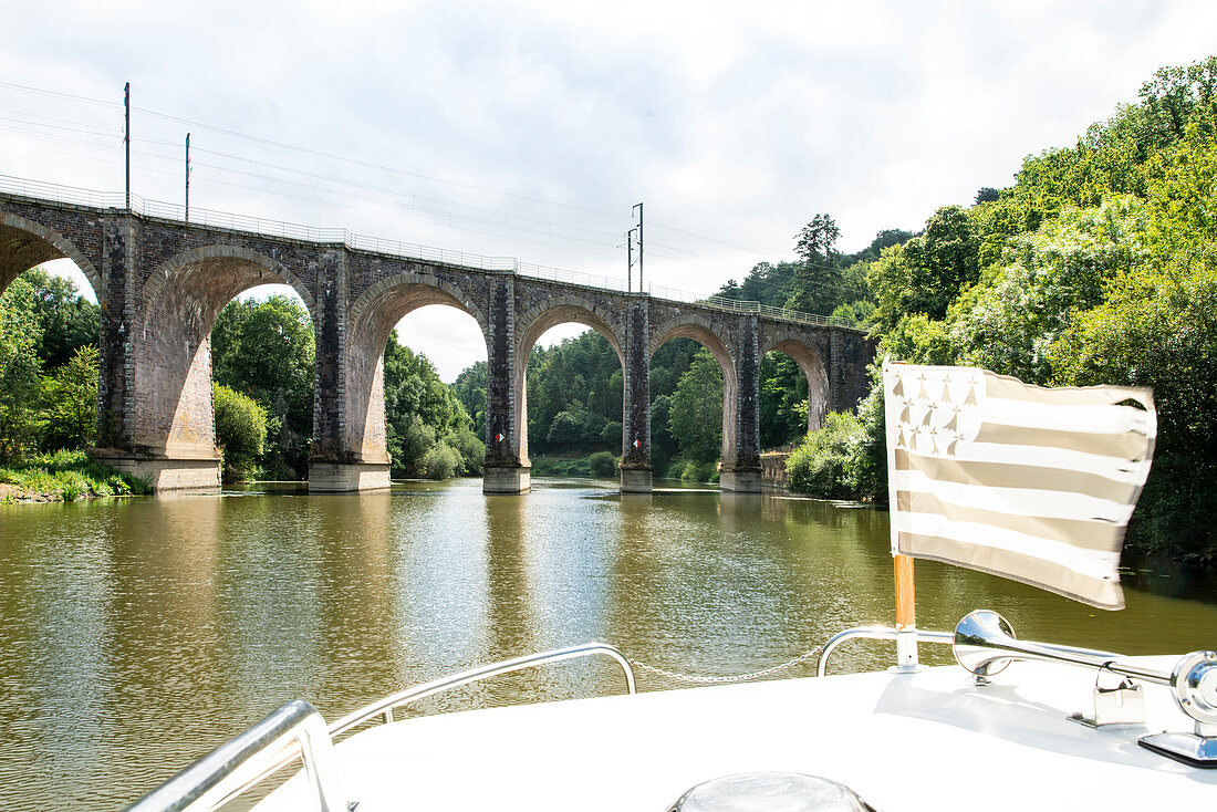 View from houseboat with Brittany flag to Viaduct bridge with arcade arches, Ille-et-Vilaine department, Brittany, France, Europe