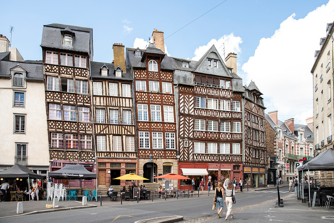 Half-timbered facade of the Place du Champ Jacquet with people and lively bars and cafes, Place du Champ Jacquet, Rennes, Ille-et-Vilaine department, Brittany, France, Europe