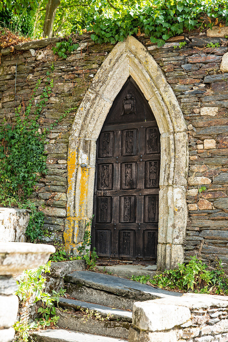 Historic door in the wall of the castle park, Rochefort en Terre, Morbihan department, Brittany, France, Europe