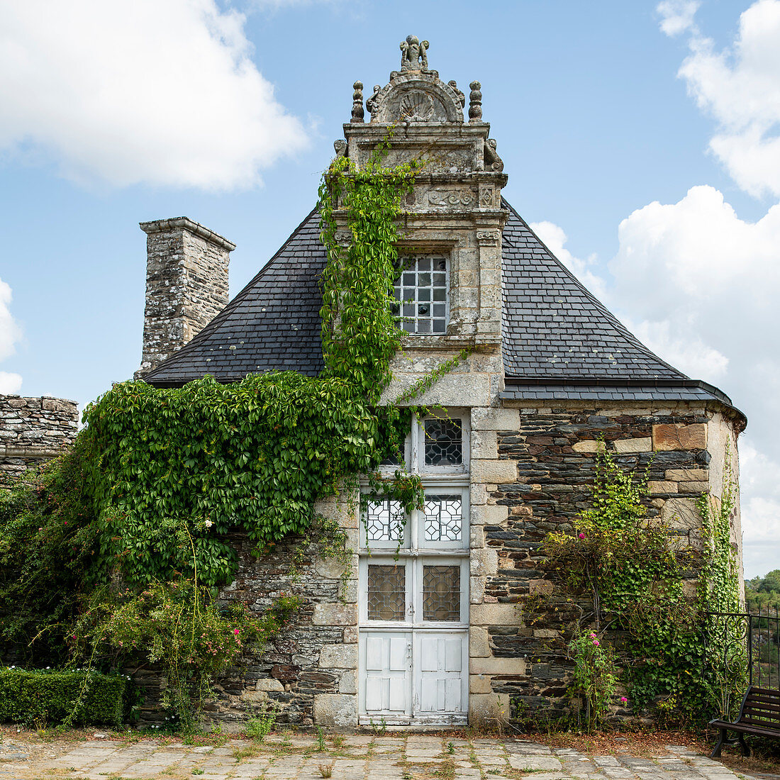 Building in the park of the Rochefort en Terre castle in summer, Morbihan department, Brittany, France, Europe