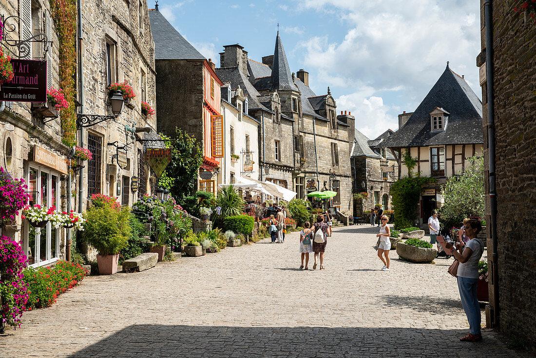 Romantic place du puits in summer with people, Rochefort en Terre, D? Partement Morbihan, Brittany, France, Europe