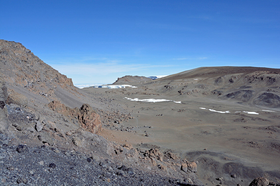 View from Uhuru Peak on the remains of the Furtwängler glacier; Volcanic landscape; melting glaciers; Lava rock