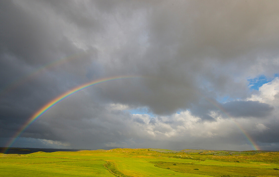 Rainbow over the golf course of Stykkishholmur, Snaefellsnes peninsula, Westfjords, Iceland