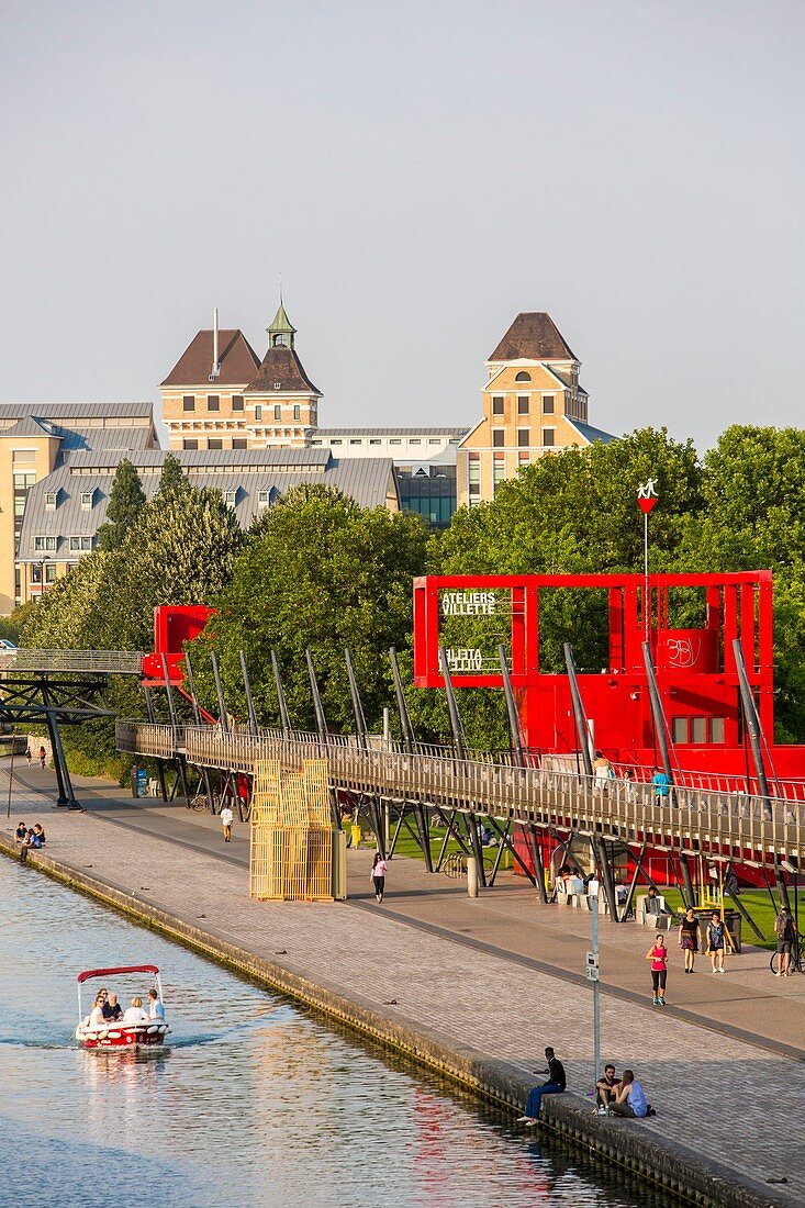 France, Paris, the Parc de la Villette, designed by architect Bernard Tschumi in 1983, the Ourcq canal, red buildings called Folies