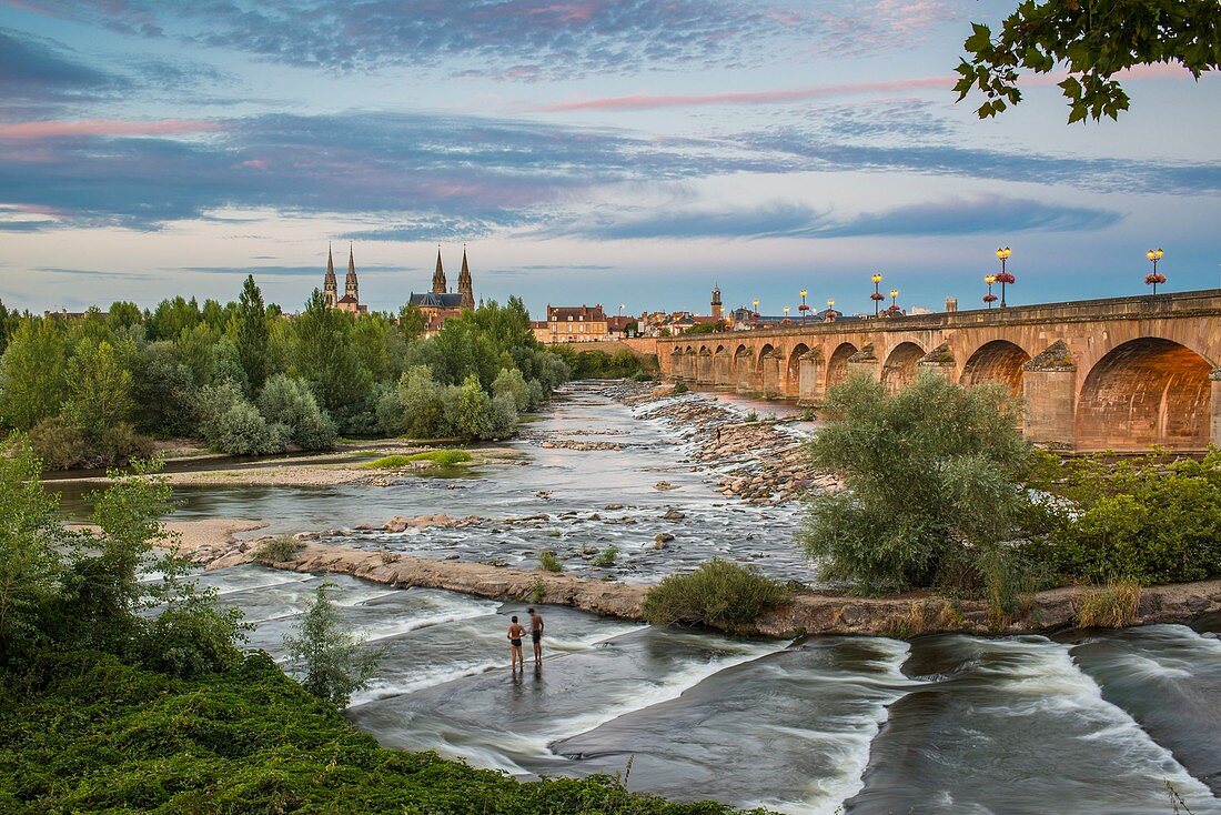 France, Allier, Moulins, view from the left bank of Allier river and Regemortes bridge, Sacred Heart church and Notre-Dame cathedral in the background