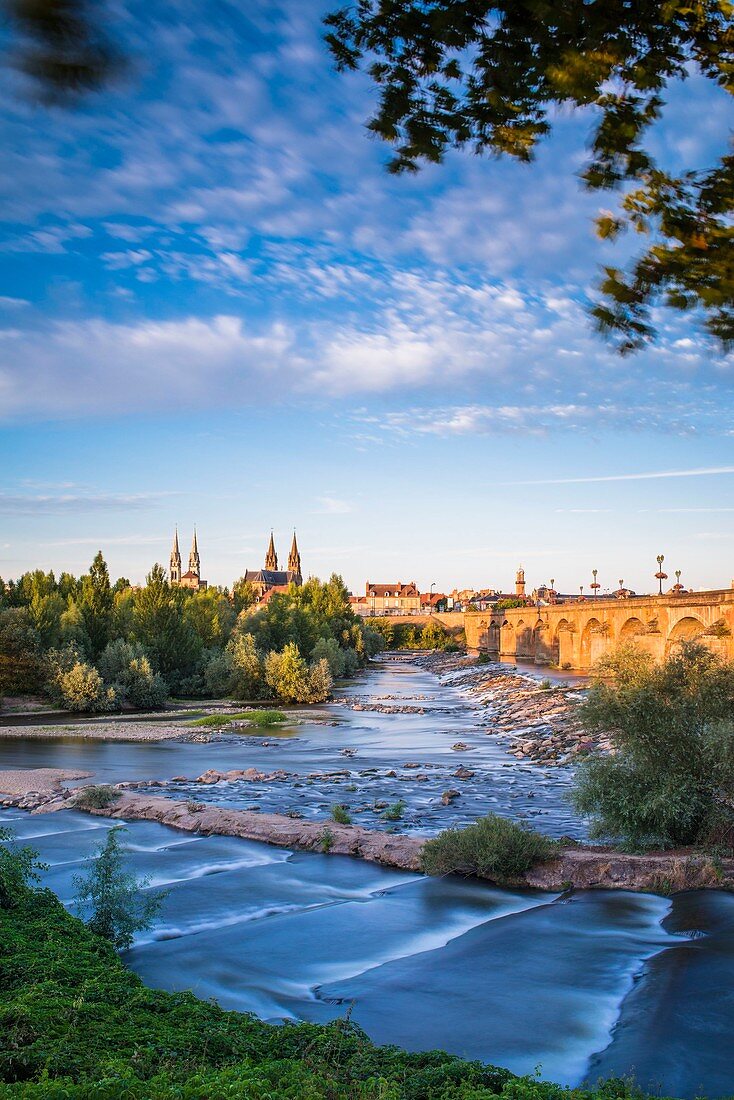 France, Allier, Moulins, view from the left bank of Allier river and Regemortes bridge, Sacred Heart church and Notre-Dame cathedral in the background