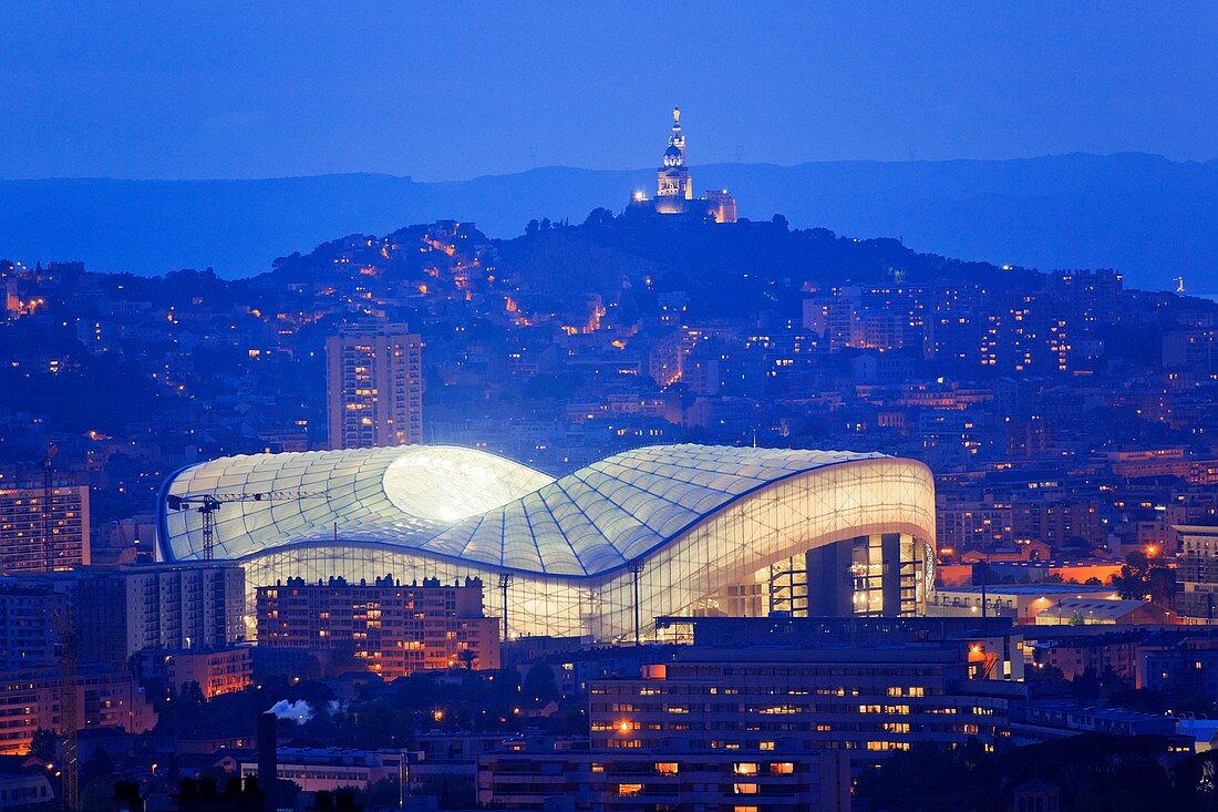 France, Bouches du Rhone, Marseille, the Velodrome stadium and the Notre Dame de La Garde background