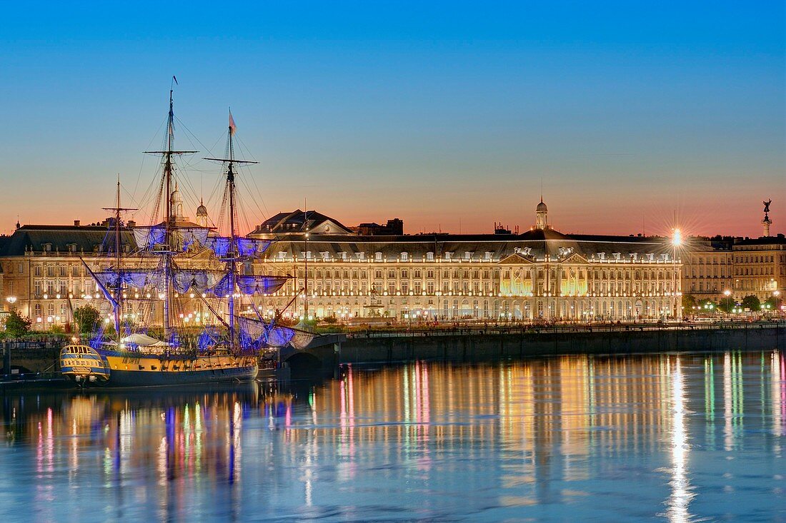 France, Gironde, area listed as World Heritage by UNESCO, the banks of the Garonne river with Hermione sailboat and the buildings of Bourse square