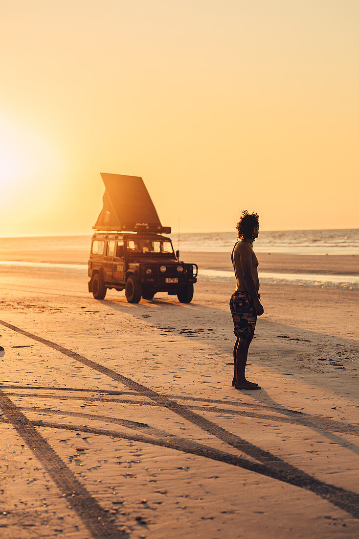 Sunset with SUVs at 80 Mile Beach in Western Australia, Australia, Indian Ocean, Oceania;