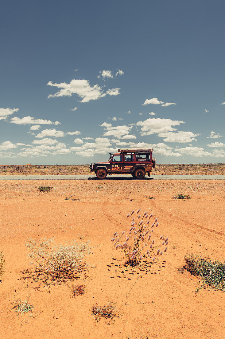 Off-road vehicle on a deserted road in the outback in Western Australia, Australia, Oceania;