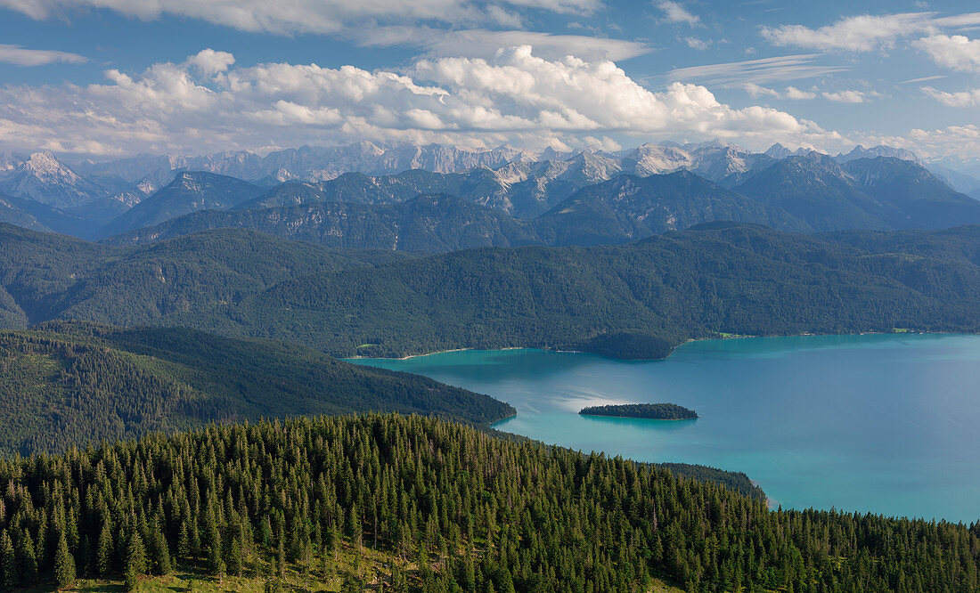 Turquoise Walchensee with Sassau island, forest, mountains and clouds, Bavaria