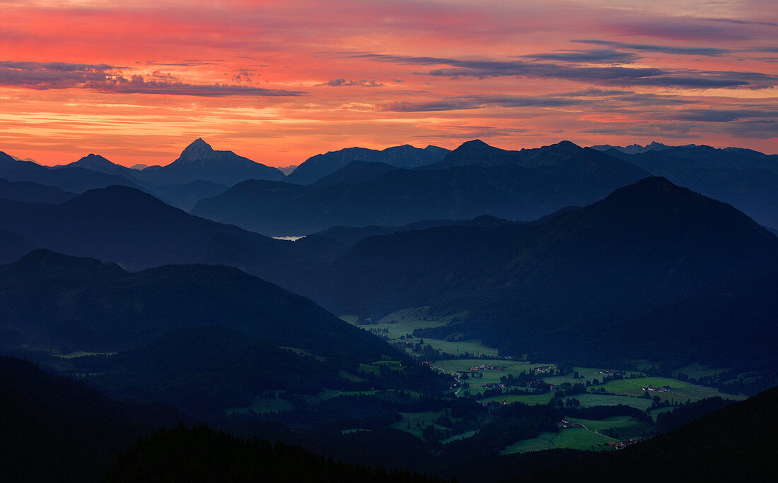 Mountain silhouettes with Jachenau am Walchensee at sunrise, from Jochberg, Bavarian Prealps