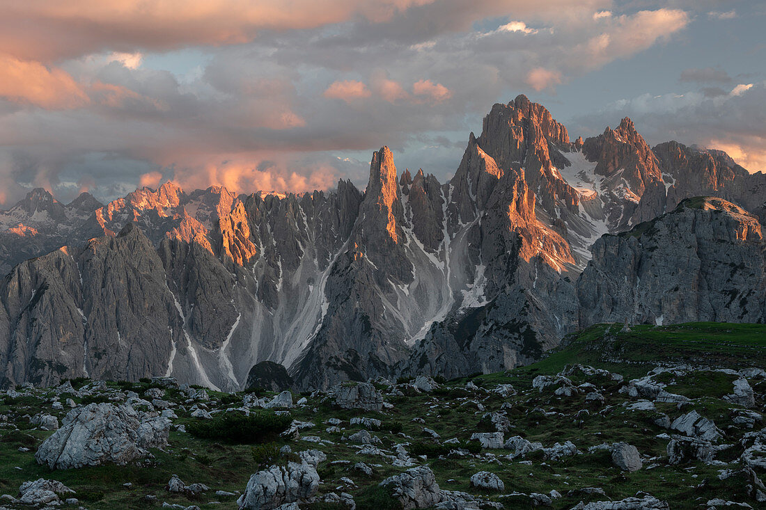 Mountain landscape with alpine glow in the Dolomites below the Lavardo hut at the Three Peaks in the sunset, South Tyrol