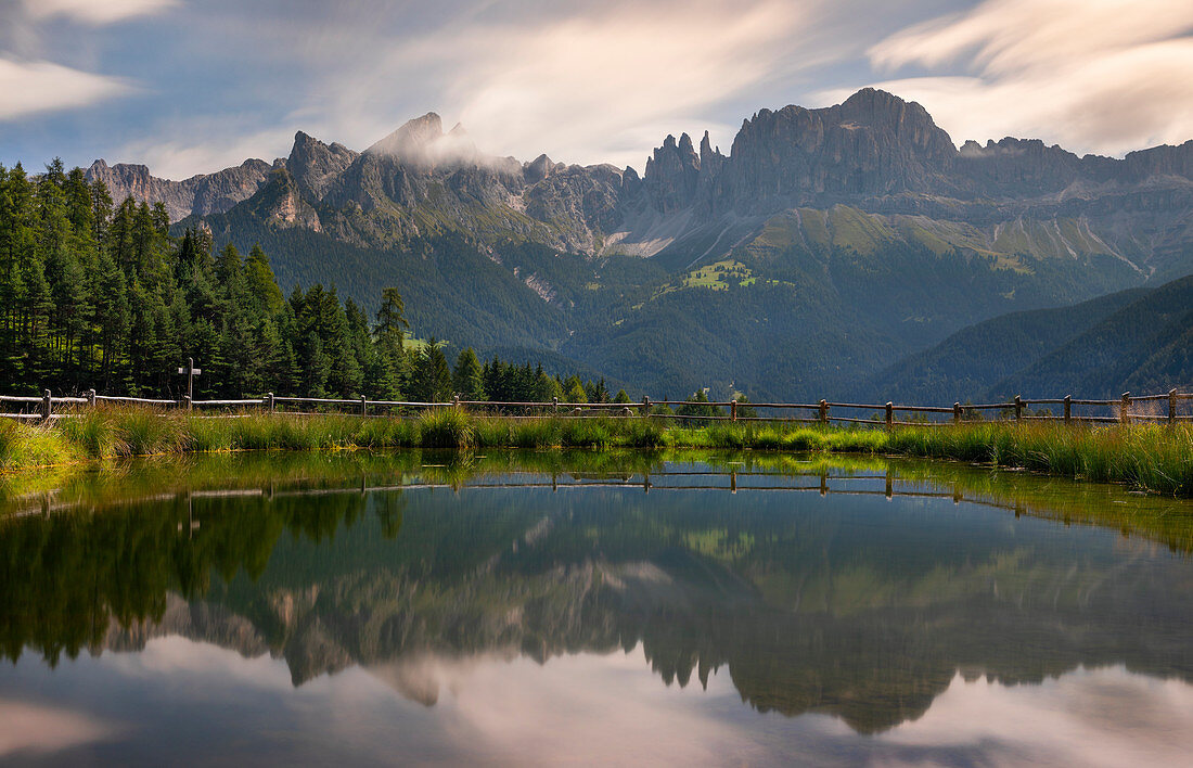 Reflection of the rose garden group in the Dolomites in Wuhnleger Löschtich, South Tyrol