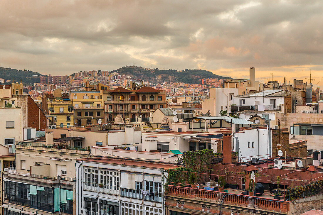View over the city rooftops during sunset in Barcelona, Spain