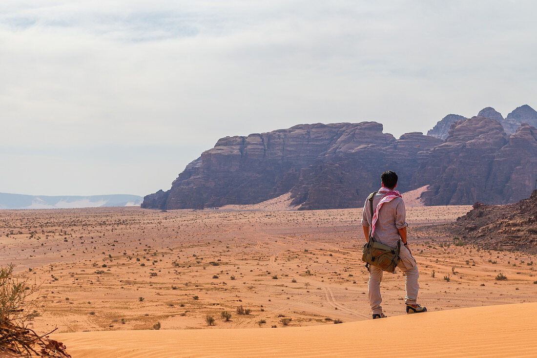 Traveler looks into the vastness of Wadi Rum in Jordan