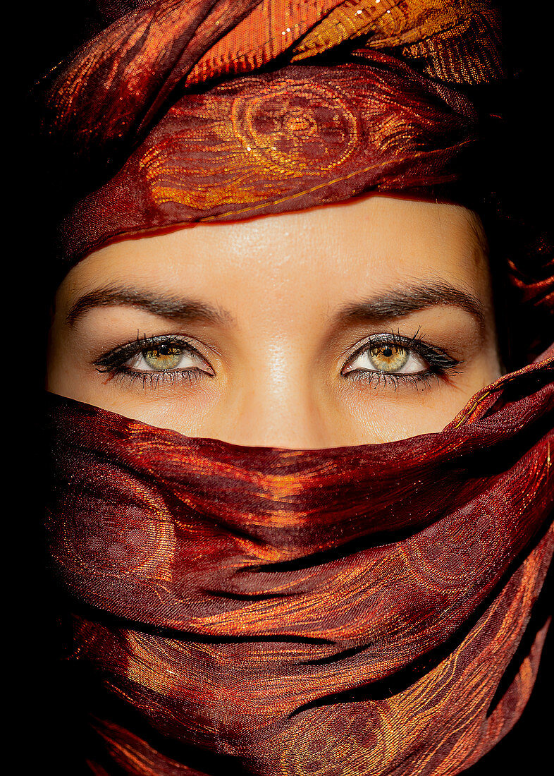 Woman in traditional dress in Erg Chebbi, Morocco