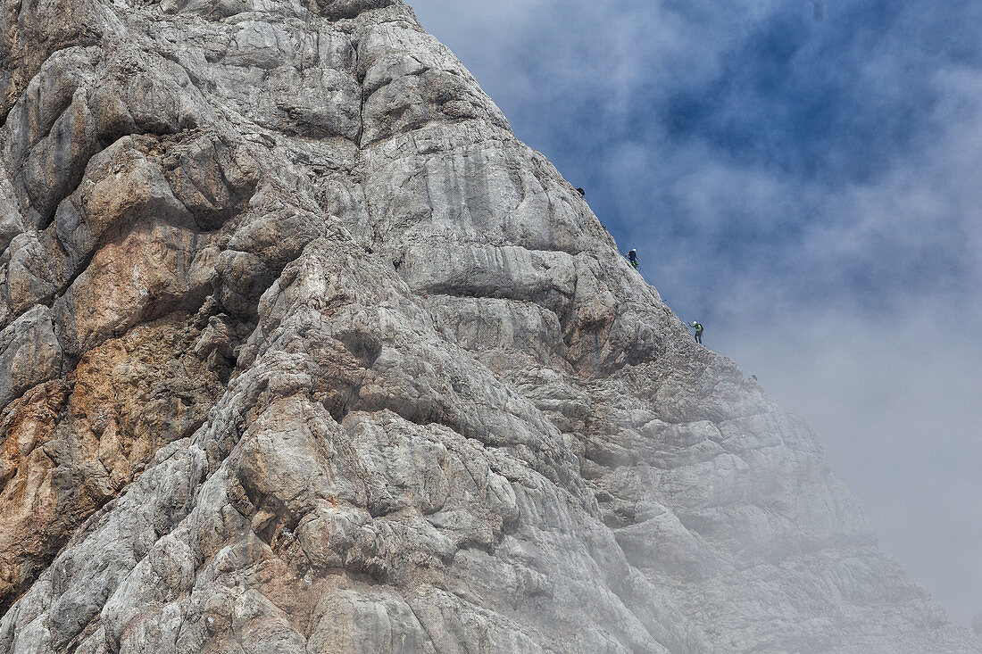 Mountaineers climb the highest mountain in Styria, Dachstein, Austria