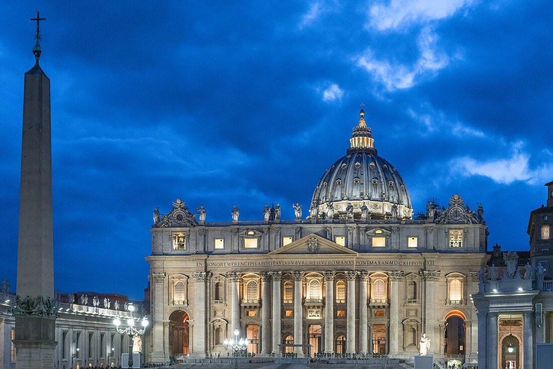 Front view of the illuminated St. Peter's Basilica in Rome, Italy