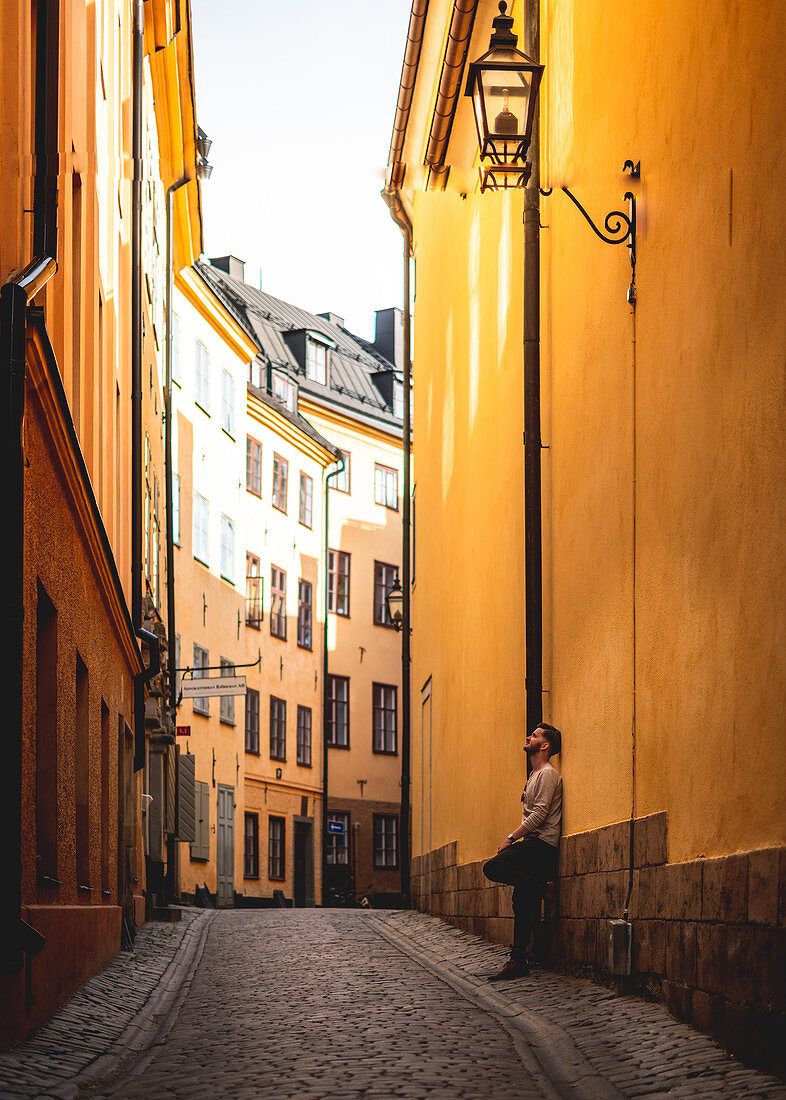 Tourist in the alleys of Gamla Stan in Stockholm, Sweden