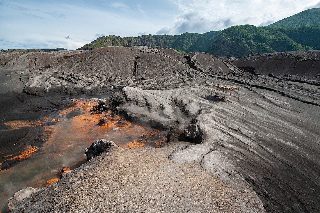This landscape near an active volcano is characterized by orange earth, hot springs, and ash and lava flows, Rabaul, East New Britain Province, Papua New Guinea, South Pacific
