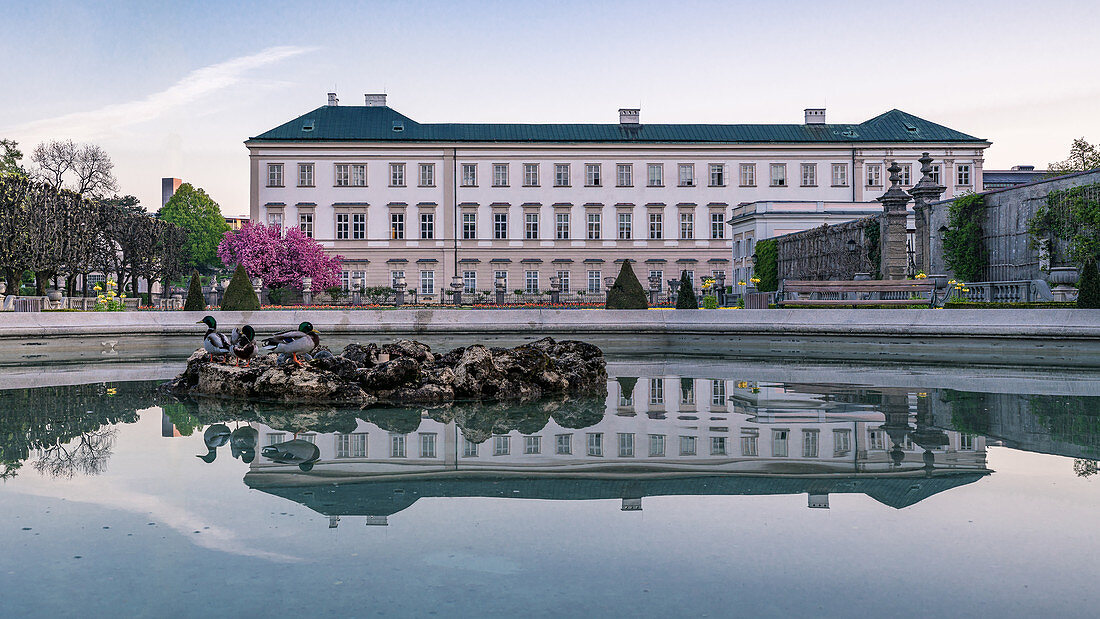 Reflection of Mirabell Palace in the Mirabell Gardens in Salzburg, Austria