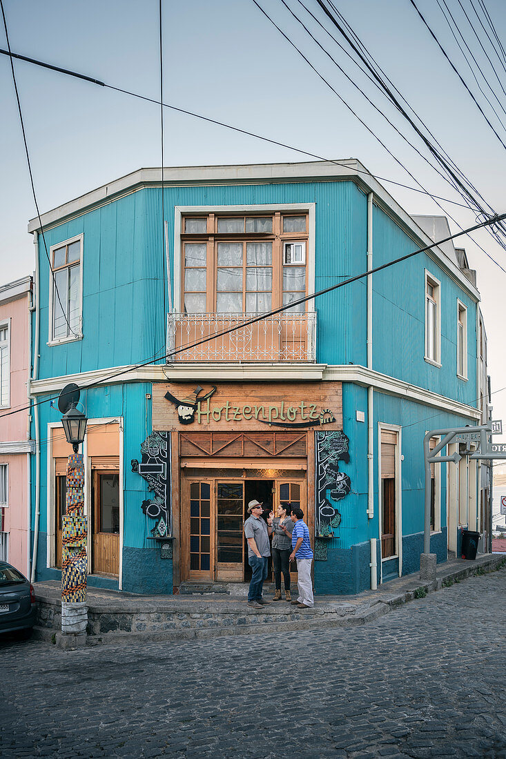 Guests smoke in front of the &quot;Hotzenplotz&quot; pub, Valparaiso, Chile, South America