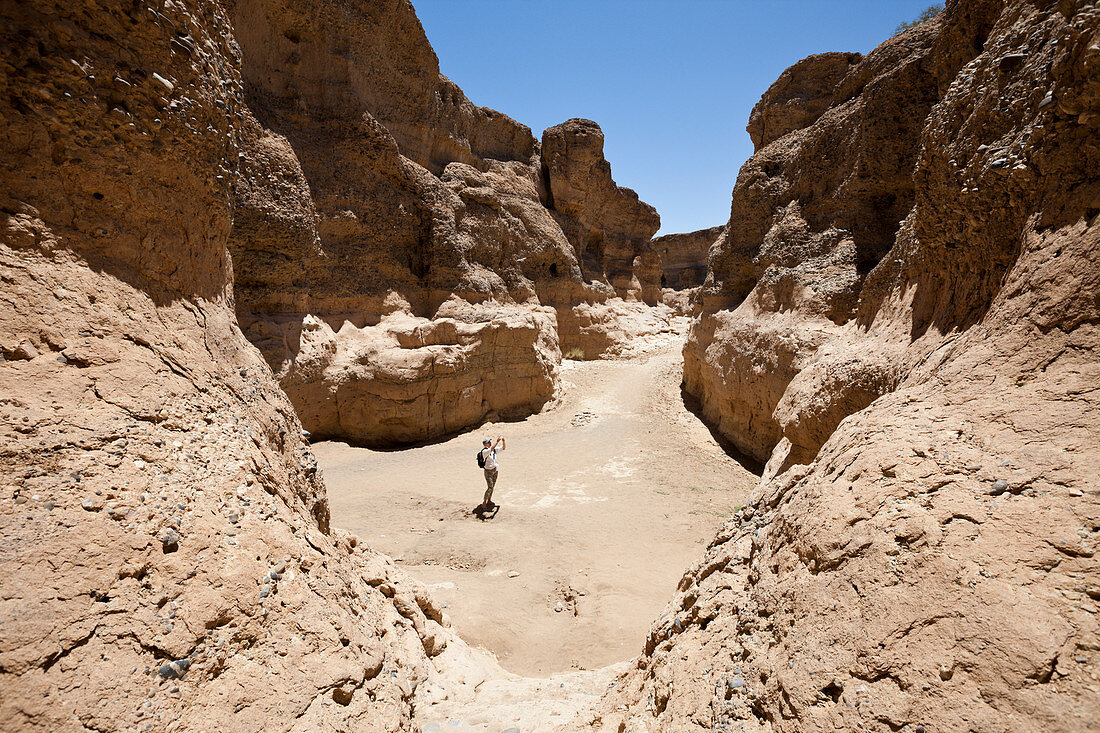 Tourist in Sesriem Canyon, Namib Naukluft Park, Namibia