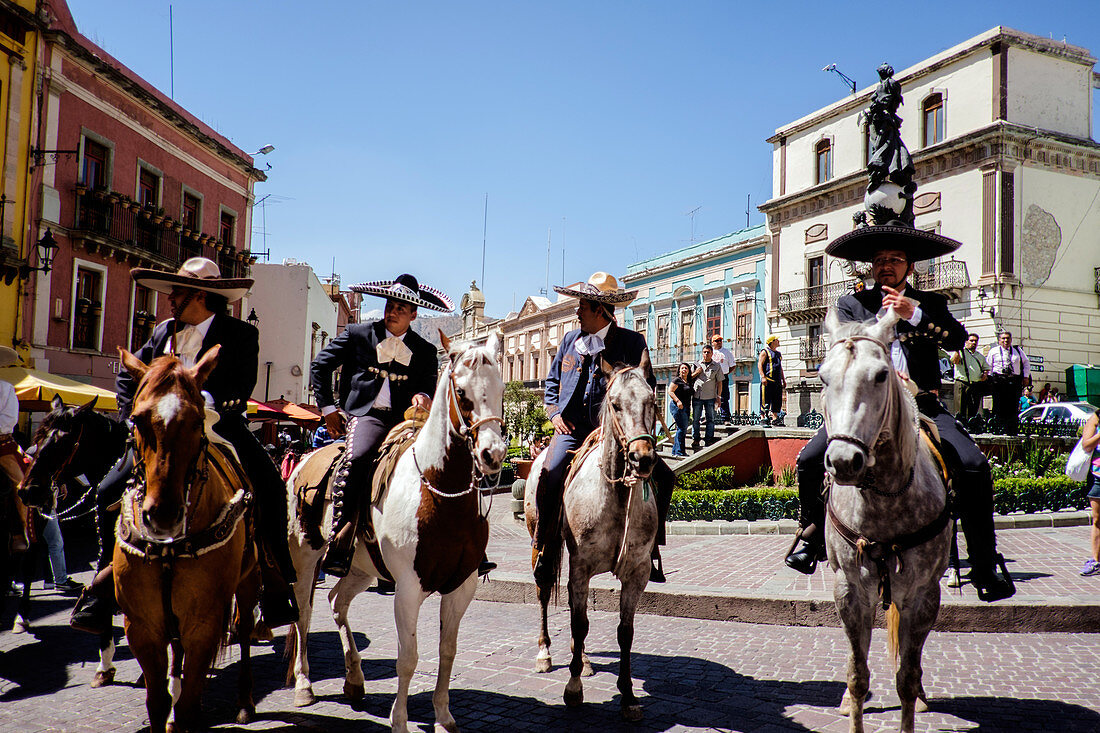 Guanajuato, Mexico - March 19, 2016: A group of man on their horses wearing tradional Mexican clothing at the local plaza.