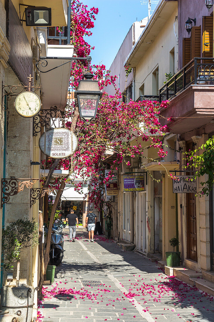 Historic streets with colorful flowers in the old town of Rethymno, North Crete, Greece