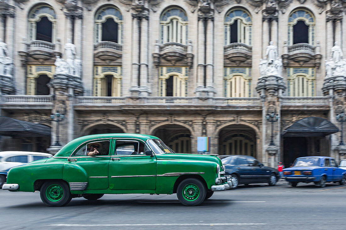 Green classic car in front of the Teatro de la Habana, Havana, Cuba